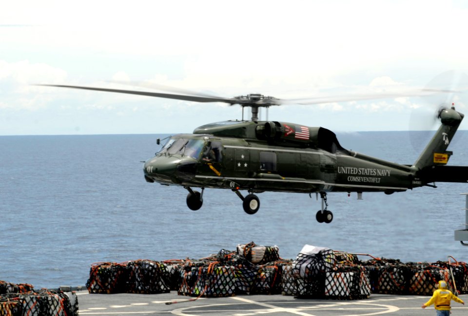 Helicopter provides supplies for the USS Blue Ridge's support of relief efforts in Japan following earthquake