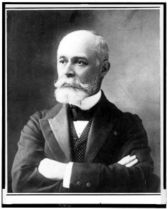 Henri Becquerel, head-and-shoulders portrait, facing left, with arms folded across chest LCCN91707847
