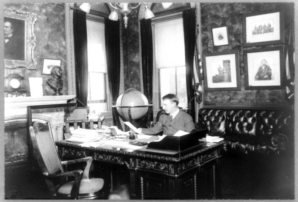Henry L. Stimson, half-length portrait, seated at desk, facing slightly left LCCN93511256