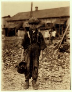 Henry, 10 year old oyster shucker who does five pots of oyster (sic) a day. Works before school, after school, and Saturdays. Been working three years. Maggioni Canning Co. LOC nclc.05334 photo