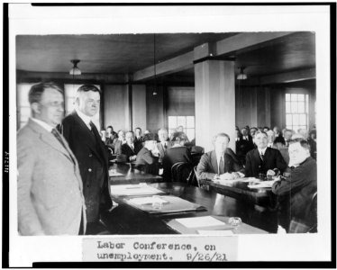Herbert Hoover and Secretary of Labor James J. Davis, half-length portrait, standing, facing right, at labor conference on unemployment LCCN94509140