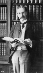 Herbert Putnam, 3-4-length portrait, holding an open book; Librarian of Congress from 1899 to 1939 LCCN2011647035