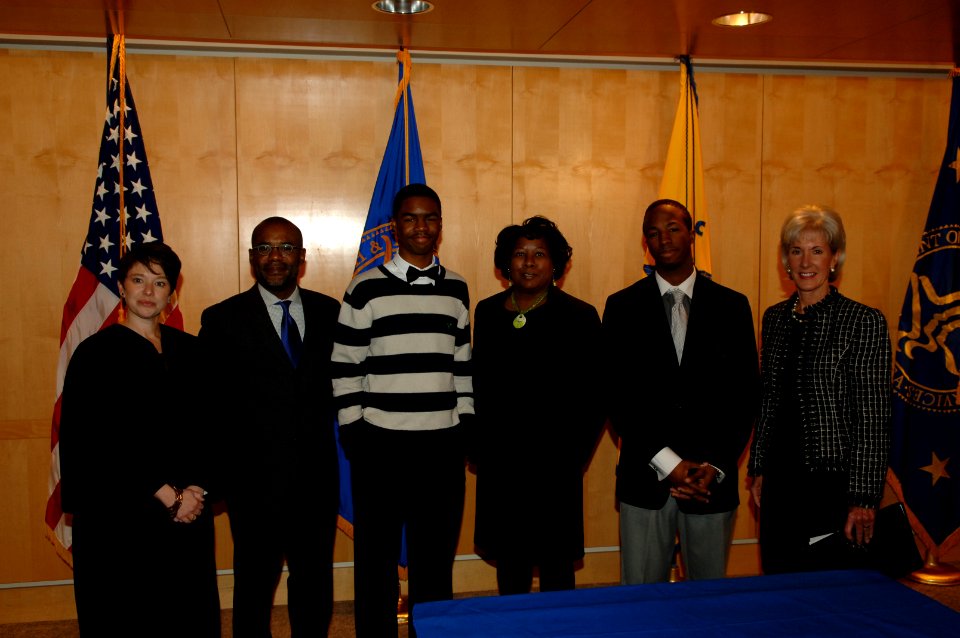 HHS Secretary Sebelius poses with a local family she helped finalize an adoption for on Friday November 19