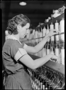 High Point, North Carolina - Textiles. Pickett Yarn Mill. Spinner at work - NARA - 518516
