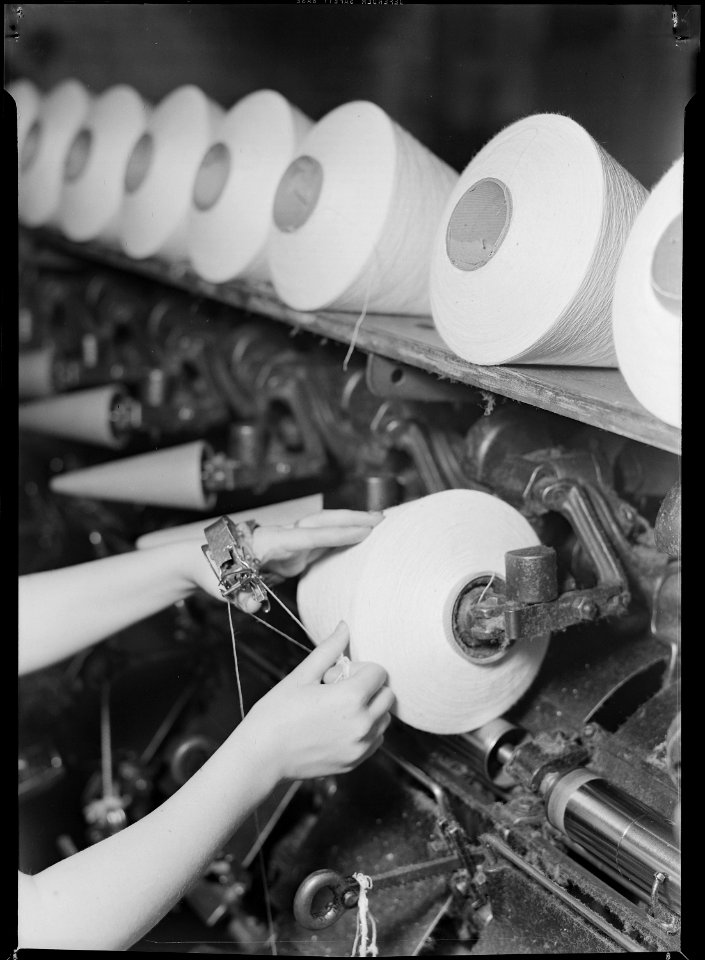 High Point, North Carolina - Textiles. Pickett Yarn Mill. Winder operator - close-up of hands - NARA - 518519