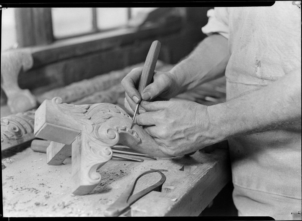 High Point, North Carolina - Upholstering. Tomlinson Chair Manufacturing Co. Hand carver - close-up of man - chair... - NARA - 518494