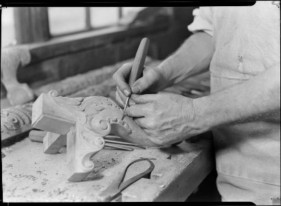 High Point, North Carolina - Upholstering. Tomlinson Chair Manufacturing Co. Hand carver - close-up of man - chair... - NARA - 518494