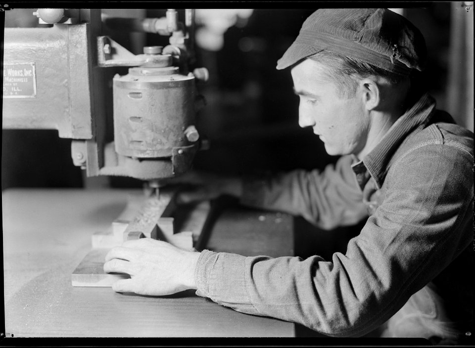 High Point, North Carolina - Upholstering. Tomlinson Chair Manufacturing Co. Air rodder - chair leg - showing machine... - NARA - 518497