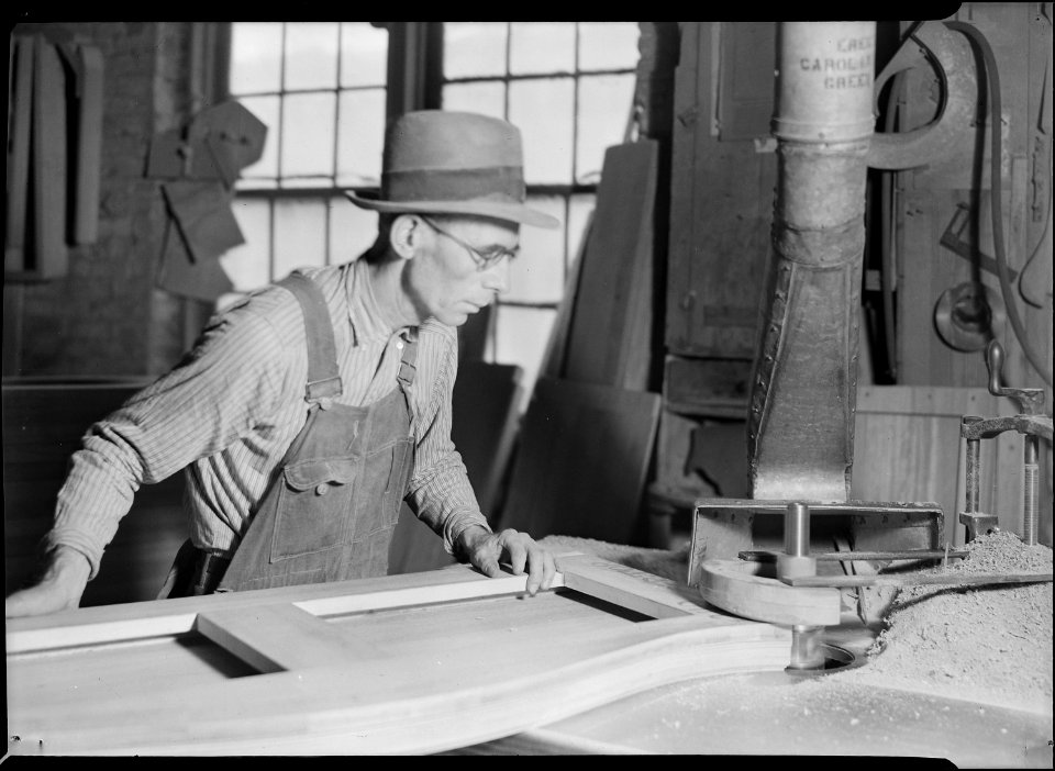 High Point, North Carolina - Upholstering. Tomlinson Chair Manufacturing Co. Shaper - shaper top - machine and man in... - NARA - 518500