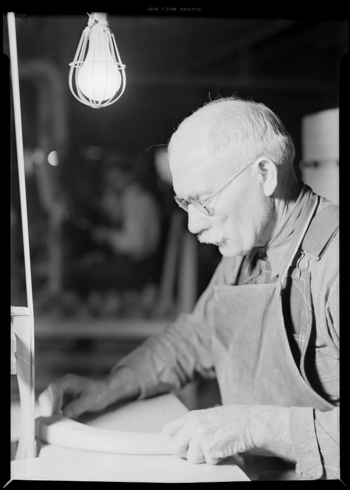 High Point, North Carolina - Upholstering. Tomlinson Chair Manufacturing Co. Upright belt sander chair arm - been at... - NARA - 518490