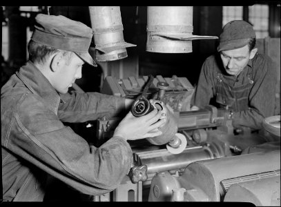 High Point, North Carolina - Upholstering. Tomlinson Chair Manufacturing Co. Grinding knives on the top ground ... - NARA - 518499
