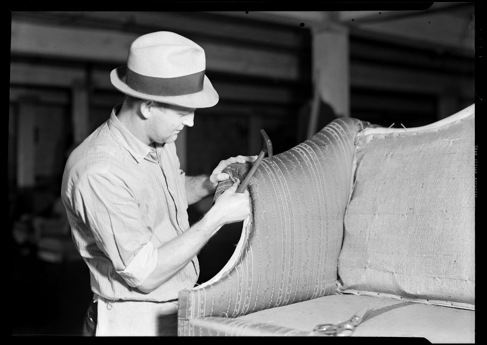 High Point, North Carolina - Upholstering. Tomlinson Chair Manufacturing Co. Upholstering arm - two seated sofa ... - NARA - 518478