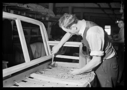 High Point, North Carolina - Upholstering. Tomlinson Chair Manufacturing Co. Webbing - Sewing in and tacking webbing... - NARA - 518475