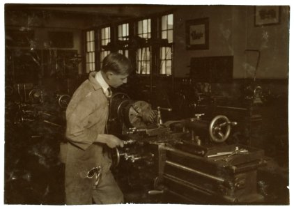 High School boy at work in machine shop. Oklahoma City High School. LOC nclc.05207