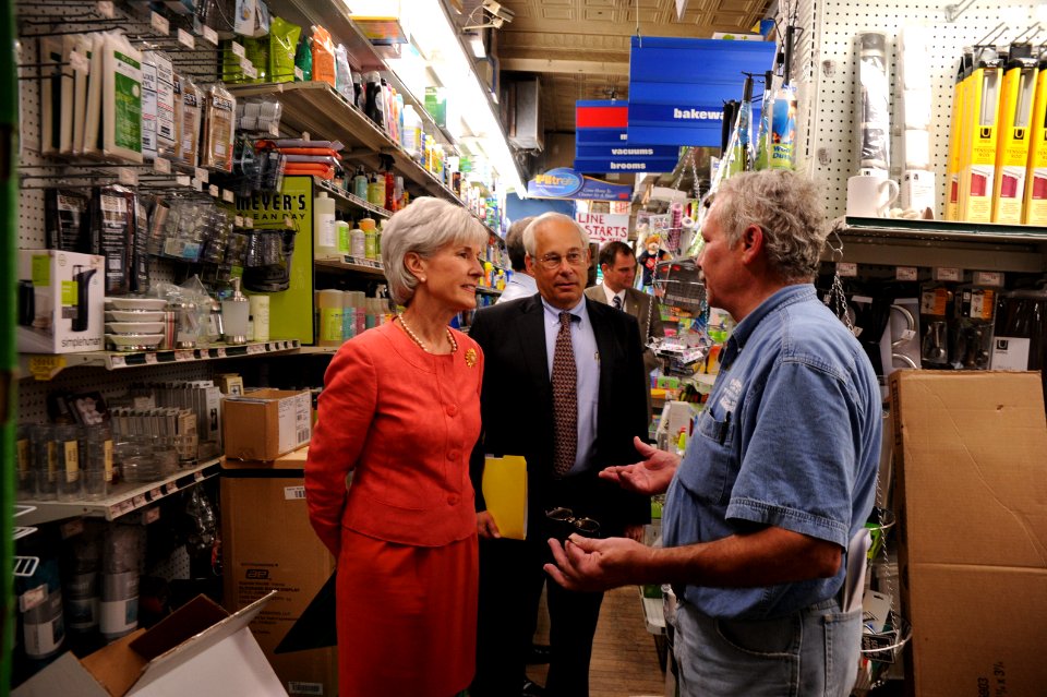 HHS Secretary Sebelius speaks with General Manager of Frager's Hardware Store during a brief tour of the facility