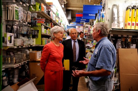 HHS Secretary Sebelius speaks with General Manager of Frager's Hardware Store during a brief tour of the facility
