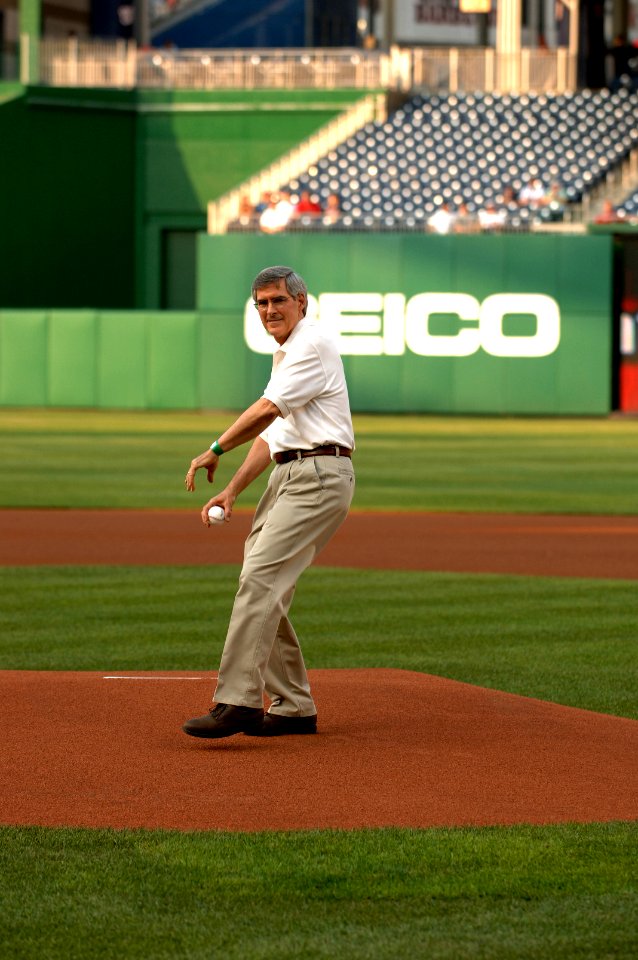 HHS Deputy Secretary Bill Corr throws out the first pitch at HHS Night at the Ballpark