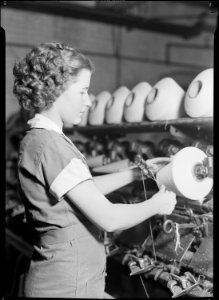 High Point, North Carolina - Textiles. Pickett Yarn Mill. Winder operator - highly skilled - showing hands in... - NARA - 518520 photo