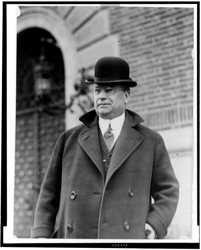 Hiram W. Johnson, half-length portrait, standing, facing left, wearing bowler hat) - National Photo Co., Washington, D.C LCCN92508773