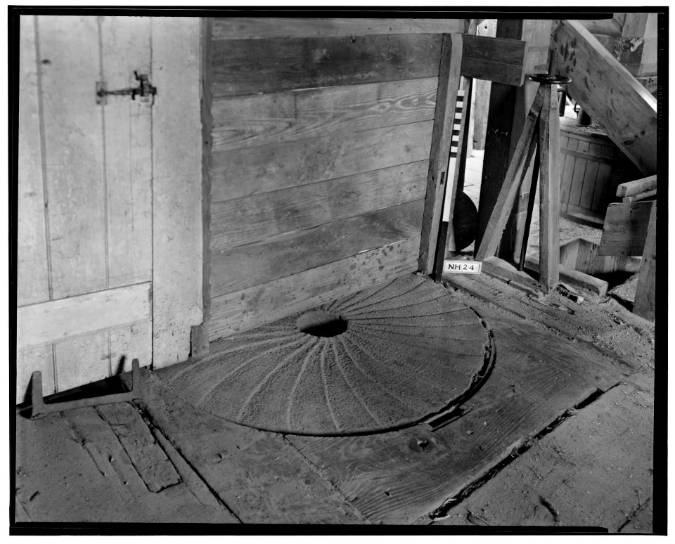 Historic American Buildings Survey L. C. Durette, Photographer March 19, 1937 LOWER GRANITE MILL STONE- ON SECOND FLOOR - Winnicut Grist Mill, Winnicut River, Stratham, Rockingham HABS NH,8-STRAT,1-11