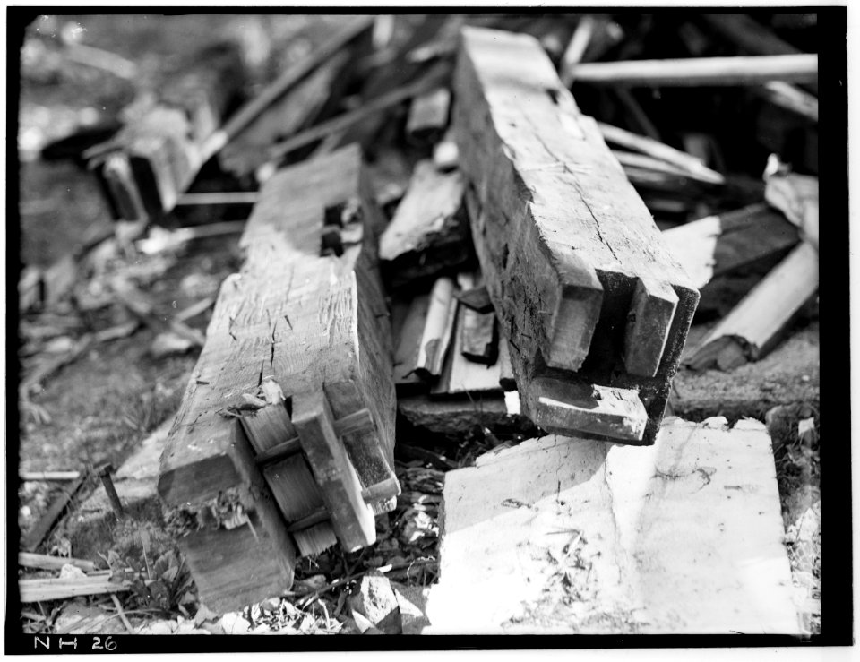 Historic American Buildings Survey L. C. Durette, Photographer TENONS AT ENDS OF INTERMEDIATE POST and CORNER POST DURING ALTERATIONS - Captain Barnes House, 218 Islington Street HABS NH,8-PORT,124-27
