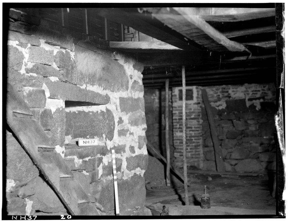 Historic American Buildings Survey L. C. Durette, Photographer CHIMNEY BASE LOOKING N.E. NOTE ORIGINAL HEWN TIMBER FRAMING THE STAIR, AND BEHIND IT A LATER SAWN TIMBER FOR PRESENT HABS NH,8-NEWM,1-46