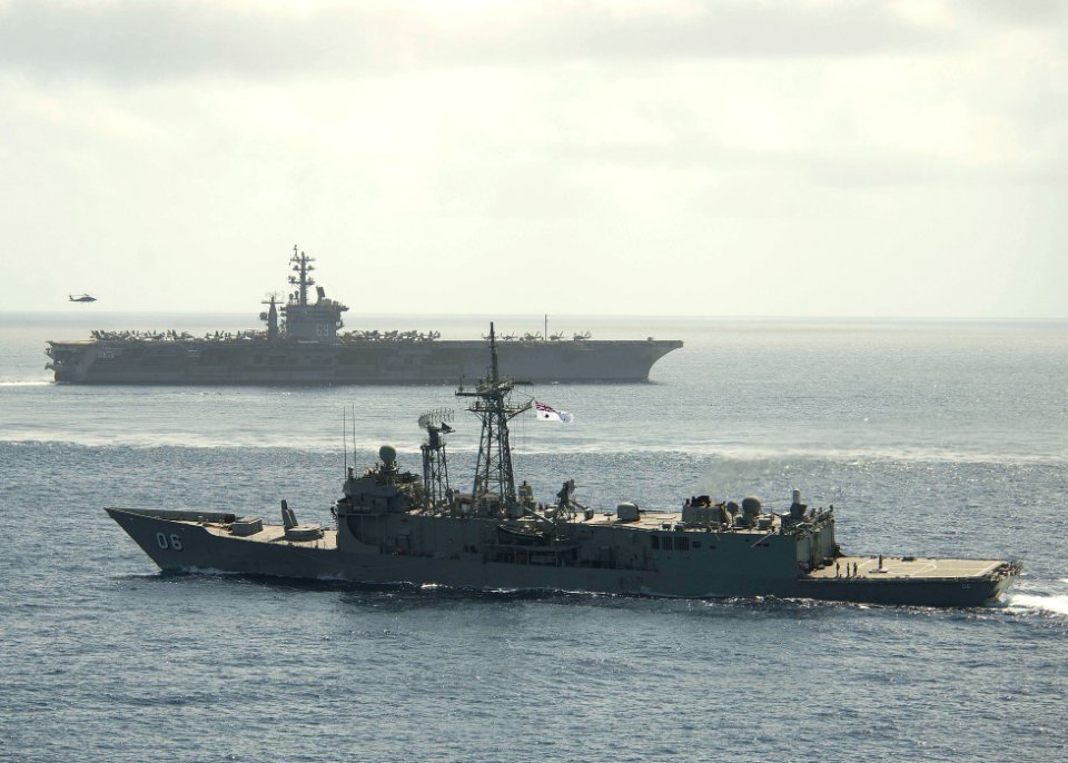 HMAS Newcastle transits alongside USS Dwight D. Eisenhower 130602-N-XQ474-375