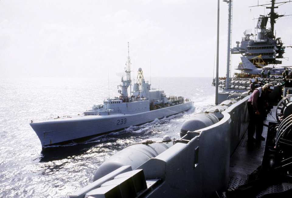 HMCS Fraser (DDH 233) sailing next to USS Saratoga (CV-60) 1985