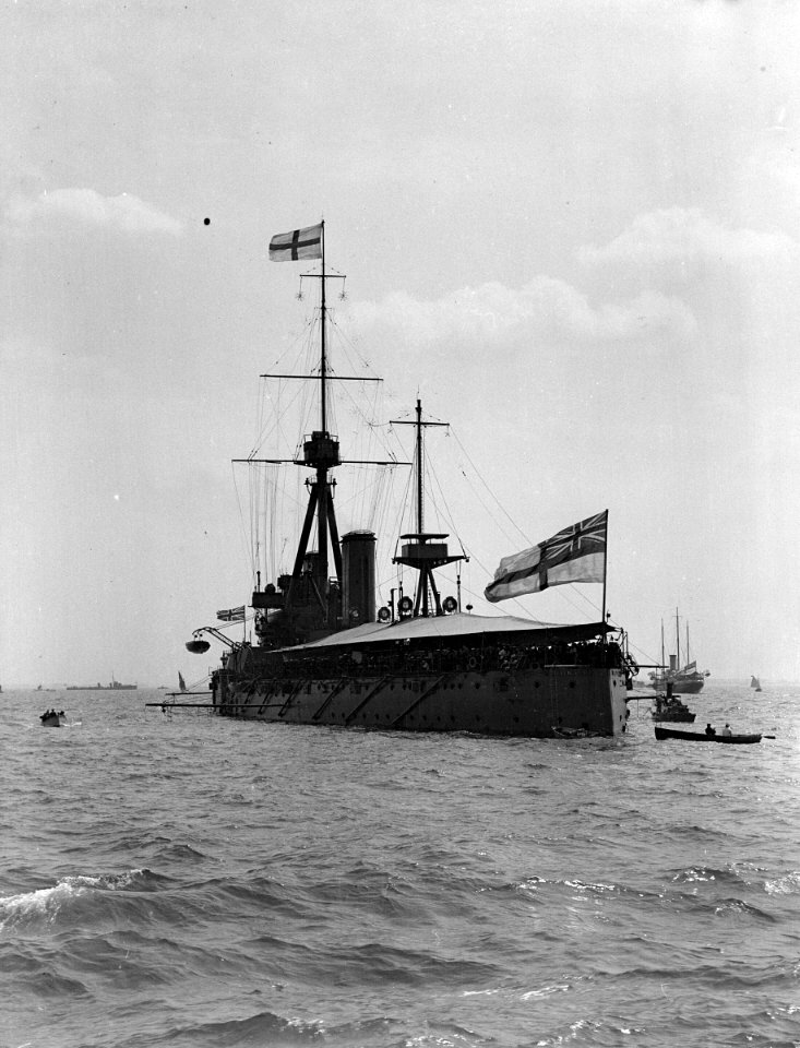HMS 'Dreadnought' (1906) with awning rigged, anchored in the Thames Estuary. RMG P00030