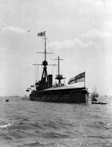 HMS 'Dreadnought' (1906) with awning rigged, anchored in the Thames Estuary. RMG P00030