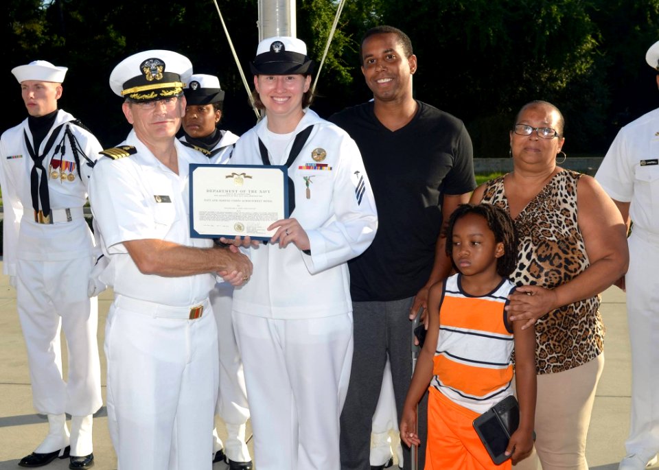 HN Marie Reinert awarded the Navy and Marine Corps Achievement Medal by CAPT William Todd, July 2016
