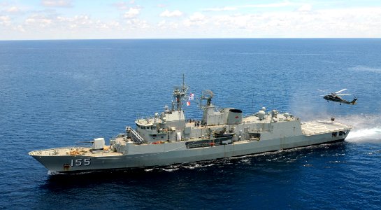 HMAS Ballarat with a US Navy helicopter in May 2012