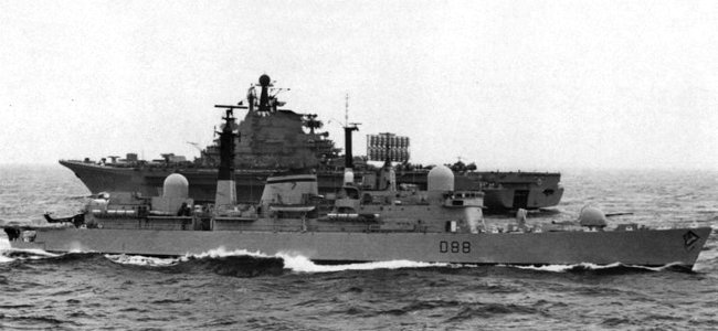 HMS Glasgow (D88) passes the Soviet aircraft carrier Kiev, in the spring of 1980 photo