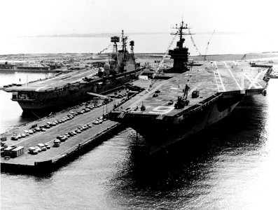 HMS Ark Royal (R09) and USS Nimitz (CVN-68) berthed at Norfolk Naval Base in April 1976