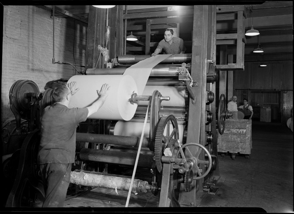 Holyoke, Massachusetts - Paper. American Writing Paper Co. Super-calender - putting on roll, starting operation. - NARA - 518330