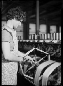 Holyoke, Massachusetts - Silk. William Skinner and Sons. Putting skein on swift to wind on bobbin (Polish). - NARA - 518321