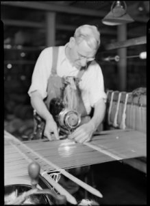 Holyoke, Massachusetts - Silk. William Skinner and Sons. Twisting in with a twisting-in machine. - NARA - 518312