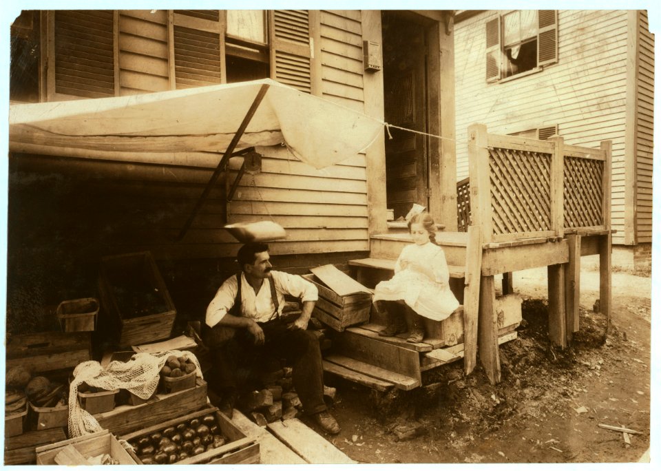 Home and fruit stand of the Cavicchio family. 64 Bedford Street. Somerville, Mass. Both the mother and Mary, 10 years old, worked off and on all day out here with the soot from the passing LOC nclc.04789