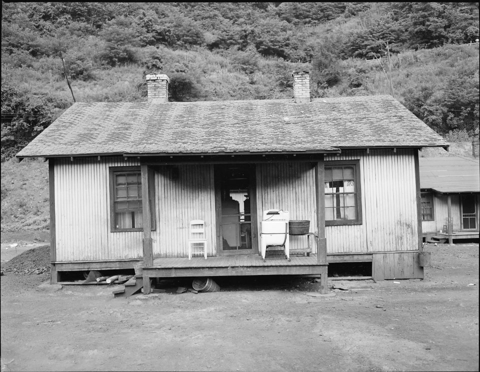 Home of miner who lives in company housing project. Note washing machine on front porch. Kingston Pocahontas Coal... - NARA - 540687