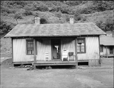 Home of miner who lives in company housing project. Note washing machine on front porch. Kingston Pocahontas Coal... - NARA - 540687