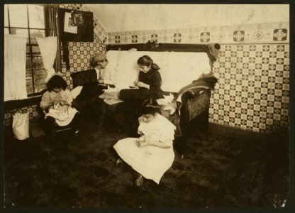 Home of Peter Mazkerthlain, 7 Elizabeth St., Worcester, Mass. Children- 6 yrs., 9 yrs., 11 yrs., 12 yrs. old, working on garter buttons. Mother works too. Make $1.50 to $2.00 a week. LOC nclc.04289