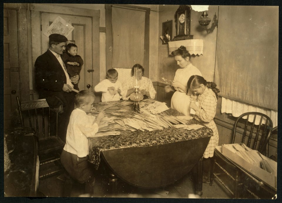 Home of Rufine Morini, 6, Coburn Street, South Framingham, Mass. Two mothers, three children - 10, 8 and 6 years old, working on tags for Dennison. Children anaemic. Make $10 (more or less) LOC nclc.05506
