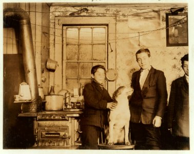 Home of the Palia family, 260 Terrace Street. The boy, Amorica, in center, goes to the canning factory with his mother in summer. LOC cph.3b06594