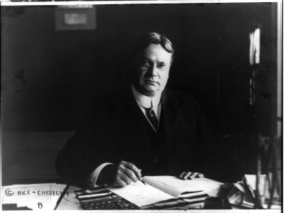 Hon. Hiram Warren Johnson, 1866-1945, seated at desk LCCN2016646930