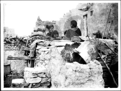 Hopi (Moki) Indian family in front of their house at Oraibi, Arizona, ca.1900 (CHS-4590)
