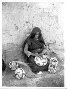 Hopi basket weaver, Koch-ye-amp-se, at Mishongnovi, Arizona, ca.1897 (CHS-4739)