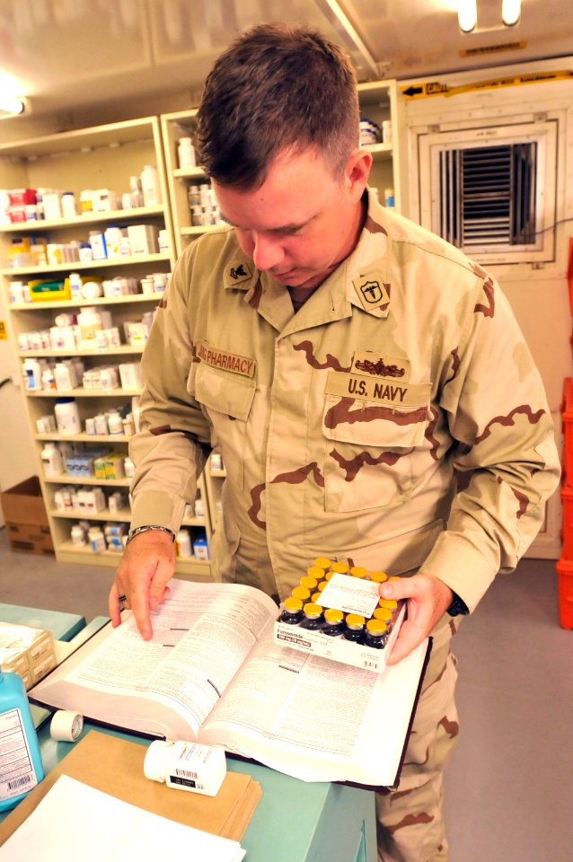 Hospital Corpsman 2nd Class Daniel McNally verifies the components of a medicine in the detention hospital, Dec. 29, 2010. DVIDS355339