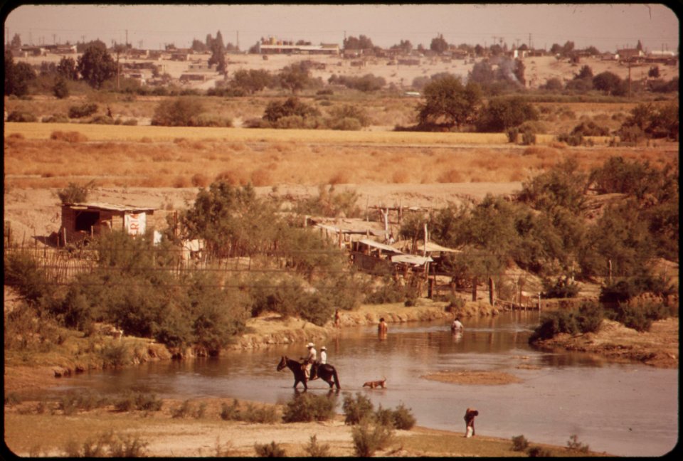 Horseman-crossing-colorado-river-in-mexico-just-below-us-border-river-at-this-point-contains-runoff-from-the-drainage-ditches-of-irrigated-farm-fields-all-of-fresh-water-has-been-diverted-upstream-june-1972 7006506942 o