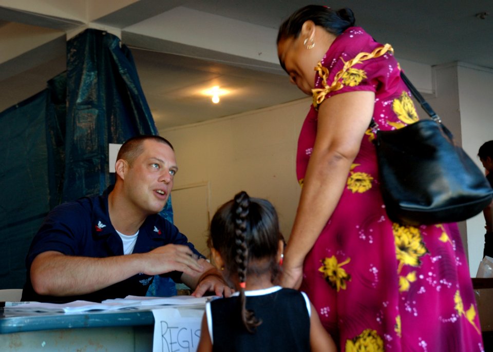 Hospital Corpsman 2nd Class John Duvall registers a patient DVIDS55319