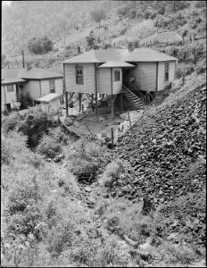 Houses and ditch. Mullens Smokeless Coal Company, Mullens Mine, Harmco, Wyoming County, West Virginia. - NARA - 540961